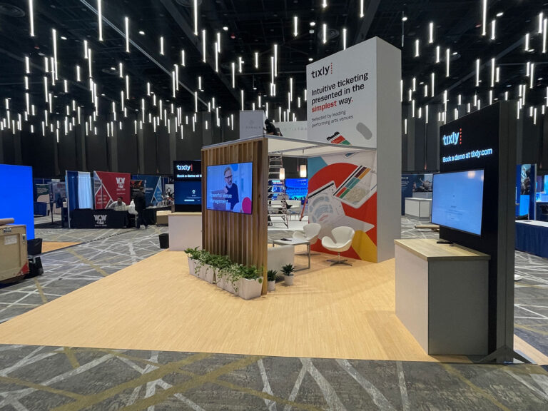 20x20 custom trade show booth with interactive displays, LED lighting, and flexible layout.
