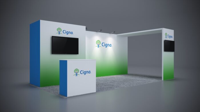 10x20 trade show exhibit with professional counters and backlit branding graphics.